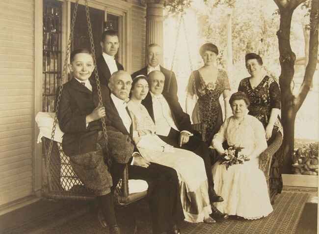 Vintage photo of folks sitting on a porch.