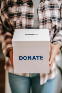 volunteer holding a donation box