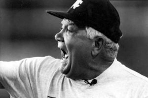 Photo of Lindy Lauro wearing cap and yelling.