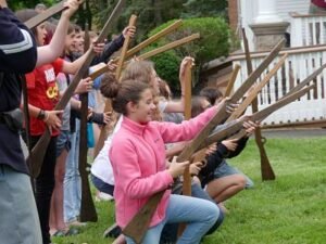 Photo of students holding Civil War mock up rifles