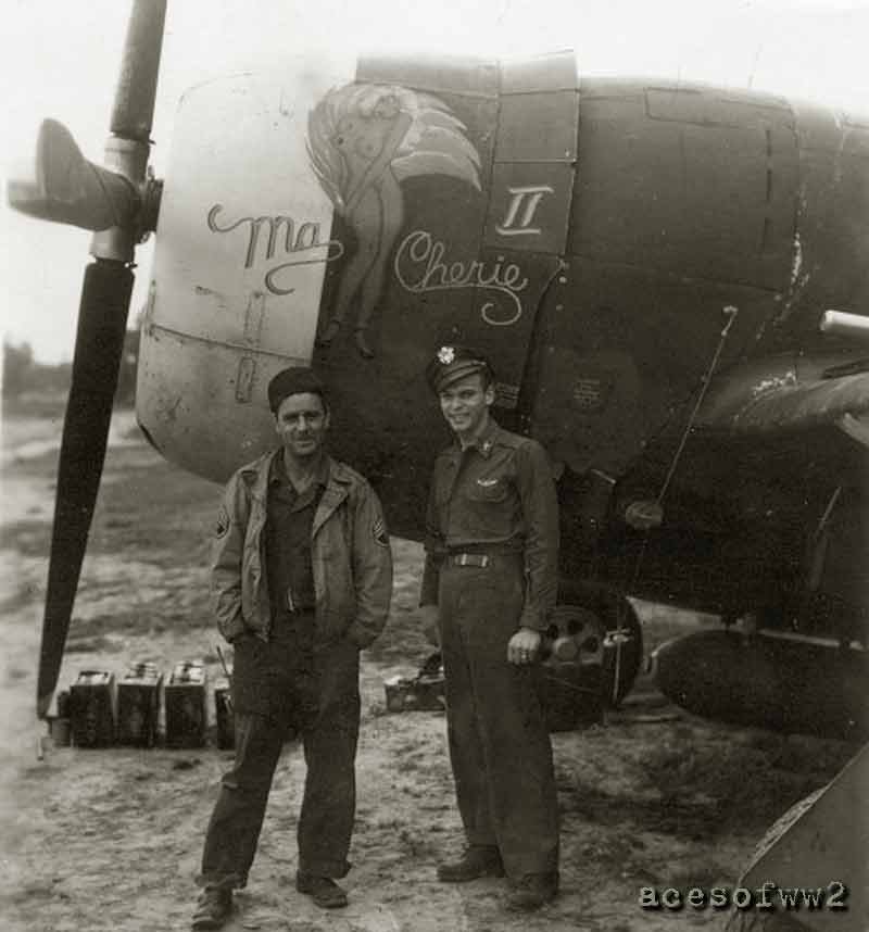 Lt. Victor Nicholas “Vic” Cabas with his crew chief standing beside the front of a P47 fighter named Ma Cherie II.