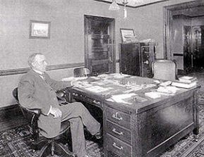 george greer sitting at his desk