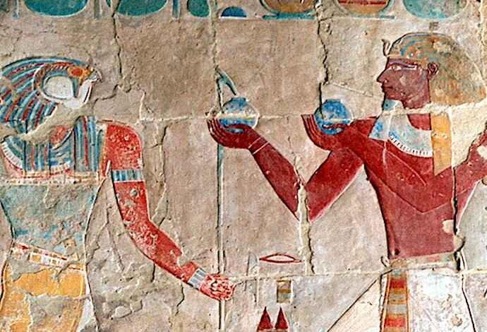 Photo of ancient peoples holding oil bottles.