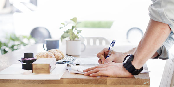 photo of person writing document