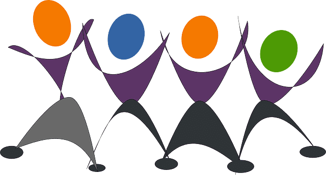 Team of people raising their arms in celebration.